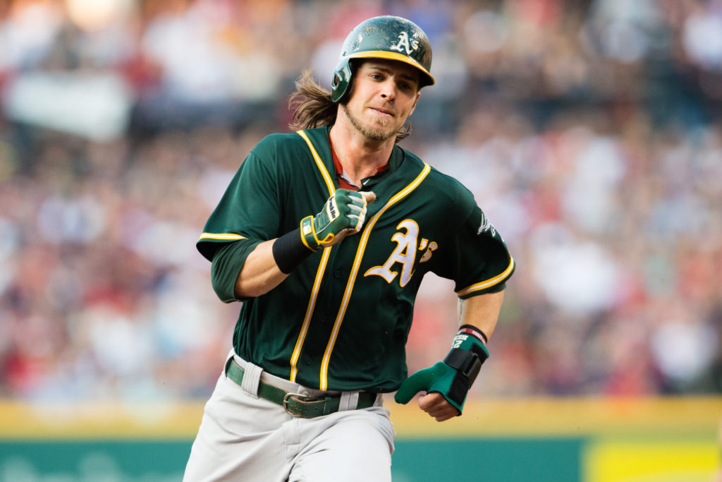 CLEVELAND, OH - JULY 30: Josh Reddick #22 of the Oakland Athletics rounds second on his way to third off a hit by Danny Valencia #26 during the first inning against the Cleveland Indians at Progressive Field on July 30, 2016 in Cleveland, Ohio. (Photo by Jason Miller/Getty Images)